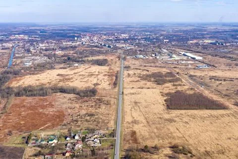 View from the height of the highway in the fields leading to the city Stock Photos