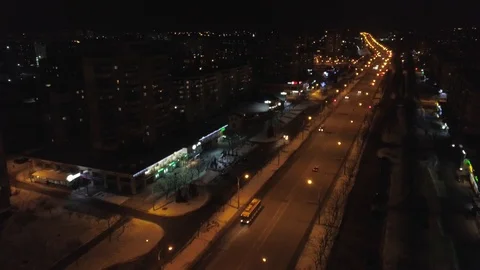 View from the height to the illuminated busy road and night city, multi-storey Stock Footage 87014444