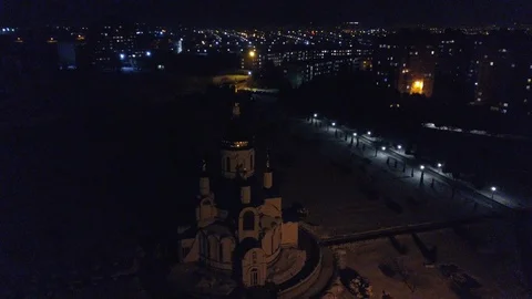 View from the height to the illuminated night city and church, multi-storey Stock Footage 87014342
