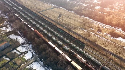 View from the height on long container freight train transporting goods across Stock Footage 103943164