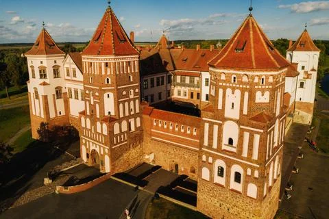 View from the height of the medieval MIR Castle in sunny summer weather Stock Photos