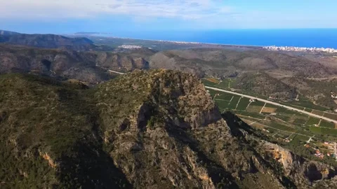 View from the height to the mountain against the backdrop of the seacoast Stock Footage 241516504
