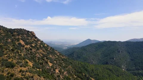View from a height to the mountain slope and valley Stock Footage 241245487