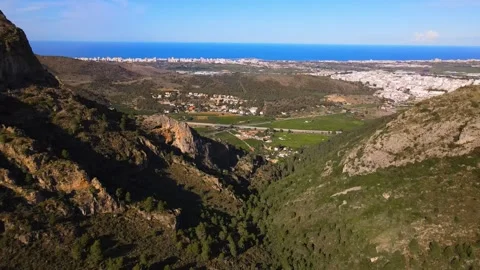 View from a height of the mountain slopes. Seashore in the background Stock Footage 241516990