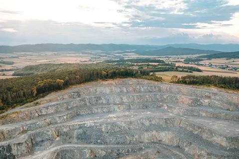 View from a height of an open stone quarry, building stone mining, granite Stock Photos