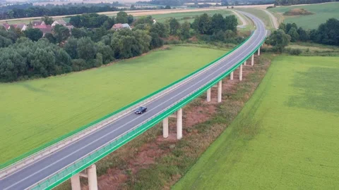 View from a height of passing cars on the bridge Stock Footage 225664757