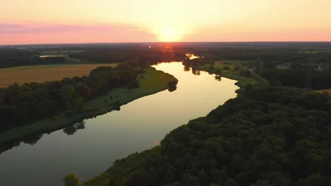View from a height of a picturesque meandering river at sunset Stock Footage 227783226