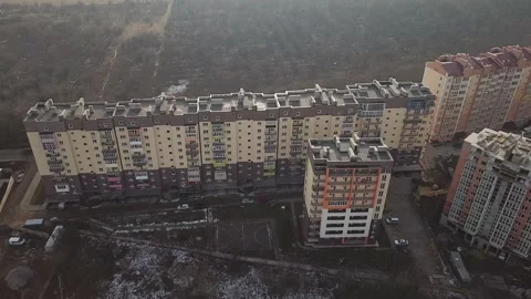 A view from a height from a quadrocopter drone to the new buildings of a new Stock Footage 229324661