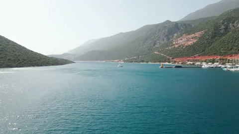 View from the height of the resort town and the harbor among the sea, Turkey 4k Stock Footage 214989660