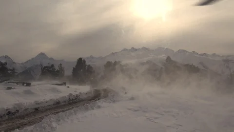 View from helicopter cabin on snow-capped mountains and mountain peaks. Stock Footage 124263905