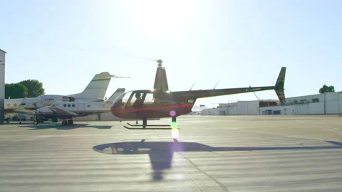 View of helicopter hovering at airport during daytime in Los Angeles, California Video stock 199460357