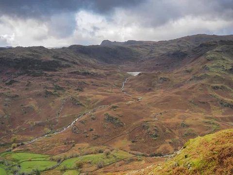View from Helm Crag over to Easedale Tarn and Langdale Pikes, Lake District Stock Photos