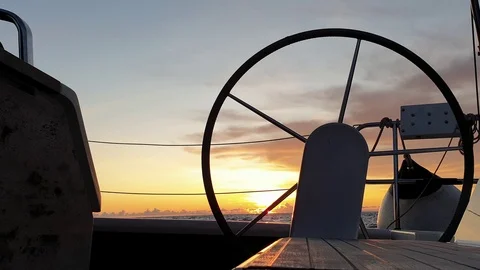 View of the helm wheel with the background of a winter sunset  Stock Footage 120745984