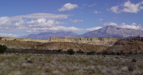 View of Henry Mountains over mesas and canyons near Capitol Reef NP Stock Footage 85489995
