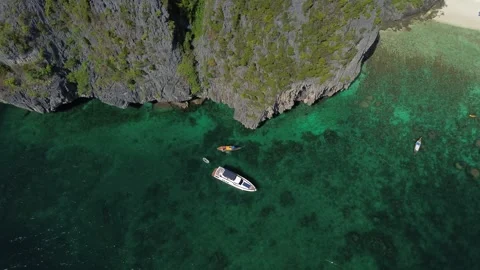 A view from a high altitude of the island of Phi Phi Don and the yacht Stock-Footage 245998708