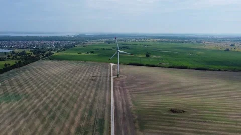 A view from a high altitude of a windmill, a renewable energy source Stock Footage 205047521