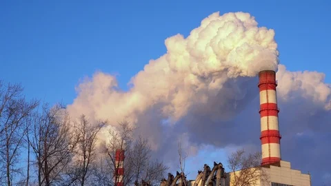 View of high chimney pipe with grey smoke from coal power plant. Production of Stock Footage 125814412