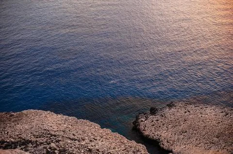 View from high cliff on dark blue mediterranean sea Stock Photos