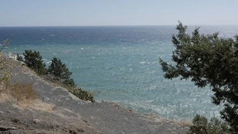 View from a high cliff to the surface of the water from the sea or ocean. Blue Stock-Footage 118638867