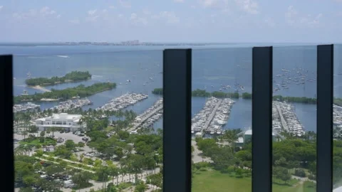 View from high floor balcony with glassy fence on dinner key marina at coconut Stock Footage 282285259