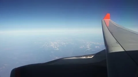 View from a high-flying plane on the wing and turbine Stock Footage 134575879