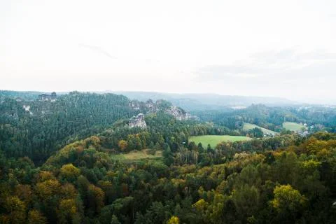 View from high mountain to dense wild green forest Stock Photos