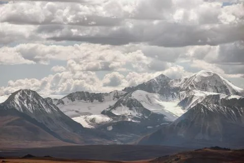 View of the high mountains on the cloudy sky background 스톡 사진