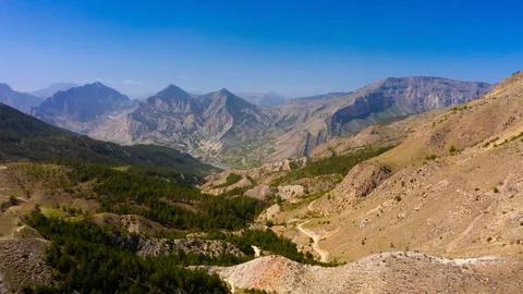 View from a high point on a mountain gorge. Aerial photography of mountains. Stock Photos