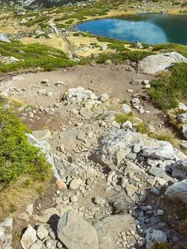 View from a high point overlooking a body of water surrounded by rocky terr.. Stock Photos