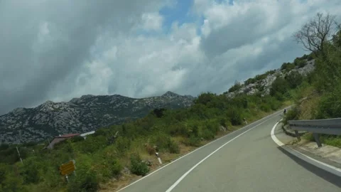 View of high quality road winding through the picturesque Croatian landscapes Stock Footage 299895483