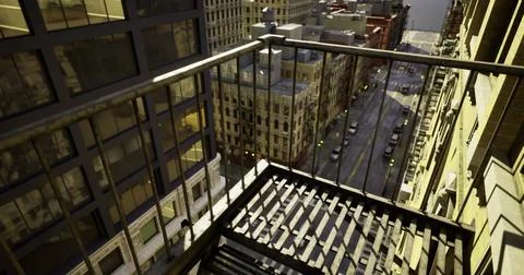 View from a high rise balcony overlooking an urban street at dusk Ilustração Stock