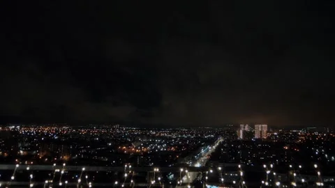 View from high roof of multi-storey building on lights of a night metropolis Stock Footage 312077621