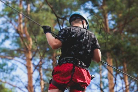 View of high ropes course, process of climbing in amusement acitivity rope .. Stock Photos