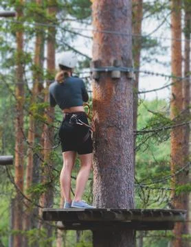 View of high ropes course, process of climbing in amusement acitivity rope .. Stock Photos