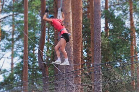 View of high ropes course, process of climbing in amusement acitivity rope .. Stock Photos