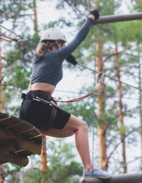 View of high ropes course, process of climbing in amusement acitivity rope .. Stock Photos
