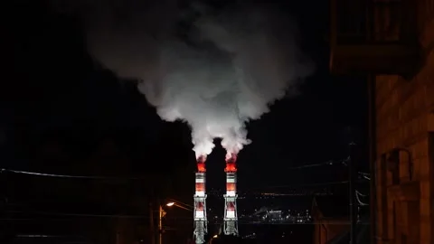 View of high smoke stack with smoke emission. Two plant pipes pollute atmosphere Stock Footage 171210374