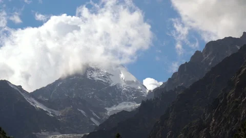 View of high snowy mountains with clouds in the sky. Stock Footage 140275180