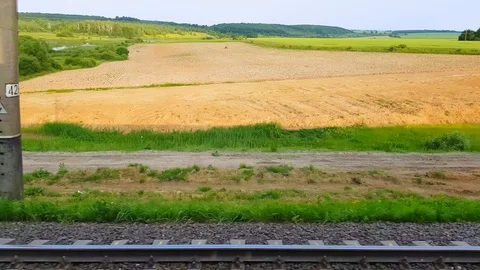 The view from the high-speed train on the beautiful scenery with hills and Stock Footage 111397612