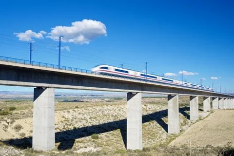 View of a high-speed train crossing a viaduct in Roden, Zaragoza, Aragon, Spain. Stock Photos
