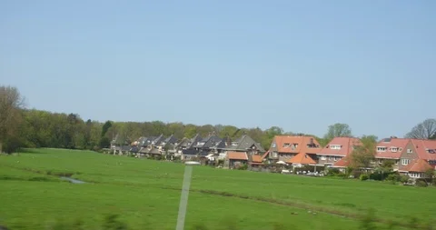 View from High speed train window of passing tulip field Stock Footage 88970962