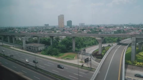 View from High Speed Train Window Passing Urban and Rural Landscape in Indonesia Stock Footage 332055637