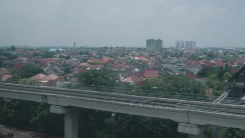 View from High Speed Train Window Passing Urban and Rural Landscape in Indonesia Stock Footage 332055798