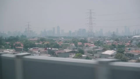 View from High Speed Train Window Passing Urban and Rural Landscape in Indonesia Stock Footage 332056040