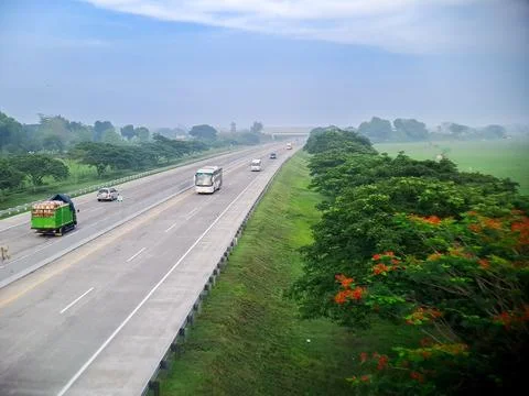 A view from a high vantage point captures vehicles driving along an expansi.. Stock Photos