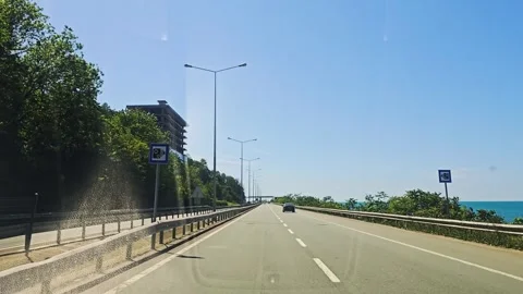 View a highway with a car driving. Stock Footage 282977760