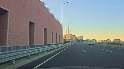 A view of a highway with a car driving on it Stock Footage 272996865