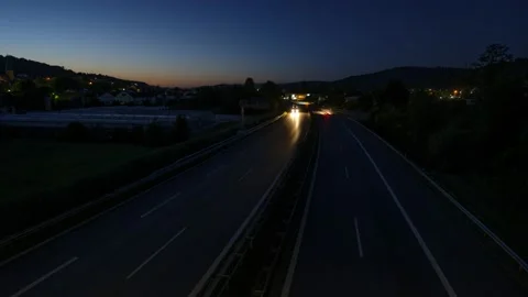 View at highway with car light trails as time lapse video Stock Footage 136950239