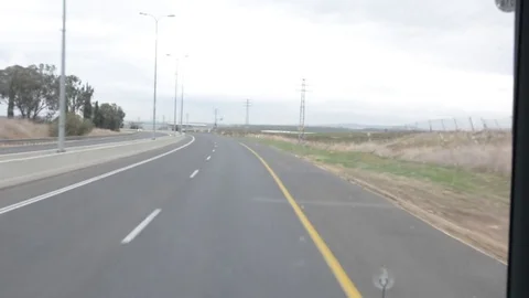 View of highway cloudysky out of bus window Stock-Footage 83154373