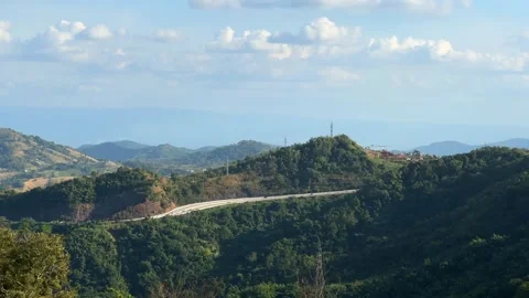 View of highway at the mountain with blue sky Stock Footage 306127627